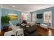 Bright and airy home office with a modern desk, comfortable seating, and large windows at 355 Highlands Trce, Roswell, GA 30075
