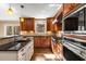 Updated kitchen featuring stainless steel appliances, custom cabinets and granite countertops at 355 Highlands Trce, Roswell, GA 30075