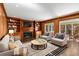 Beautiful living room with a fireplace, built-in bookshelves and plenty of natural light at 355 Highlands Trce, Roswell, GA 30075