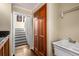 A pantry features custom wood cabinets, granite counters, and a utility sink at 355 Highlands Trce, Roswell, GA 30075