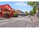 Charming street view with a mix of commercial buildings, street parking, and pedestrian walkways at 355 Highlands Trce, Roswell, GA 30075