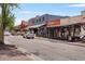 A vibrant street view showcasing an outdoor dining, diverse building facades, and street-side parking at 355 Highlands Trce, Roswell, GA 30075