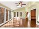 The sun room features floor to ceiling windows, hardwood floors, and tons of light at 355 Highlands Trce, Roswell, GA 30075
