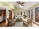 The sun room features floor to ceiling windows, hardwood floors, and great light at 355 Highlands Trce, Roswell, GA 30075