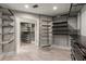 Spacious walk-in closet with custom shelving and plenty of storage space at 355 Highlands Trce, Roswell, GA 30075
