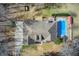 Aerial shot showcasing a pool, patio area, and well-maintained roof at 384 Minix Rd, Sharpsburg, GA 30277