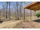 View of the wood deck overlooking the backyard and wooded area at 384 Minix Rd, Sharpsburg, GA 30277