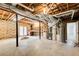 Unfinished basement with exposed ductwork, open rafters, and a door to the exterior at 384 Minix Rd, Sharpsburg, GA 30277