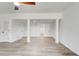A large open basement area with modern floors and painted white walls at 384 Minix Rd, Sharpsburg, GA 30277