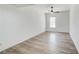 Bedroom offers natural light, wood-look floors and a modern ceiling fan at 384 Minix Rd, Sharpsburg, GA 30277