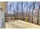 New wooden deck with wooded view and cable railing at 384 Minix Rd, Sharpsburg, GA 30277