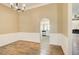 Dining room area with trim and hardwood floors that leads to a kitchen and living room area at 384 Minix Rd, Sharpsburg, GA 30277