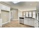 Bright kitchen with white cabinets, granite countertops, and stainless appliances, offering a functional and stylish cooking space at 384 Minix Rd, Sharpsburg, GA 30277