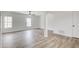 The room is painted white with wood-look flooring and plenty of natural light at 384 Minix Rd, Sharpsburg, GA 30277