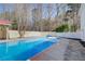 The sparkling in-ground pool features a diving board and plenty of room to swim at 384 Minix Rd, Sharpsburg, GA 30277