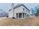 Backyard featuring a covered patio and a spacious, well-maintained lawn at 4719 Joseph Eli Dr, Snellville, GA 30039