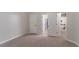 Bedroom showcasing neutral walls, carpet, and doorway to the rest of the house at 4719 Joseph Eli Dr, Snellville, GA 30039