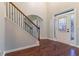 Elegant foyer features hardwood floors, a staircase with iron spindles, and natural light from the front door at 4719 Joseph Eli Dr, Snellville, GA 30039