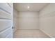 Walk-in closet featuring plush carpet and shelving at 124 Felicity Pike, Locust Grove, GA 30248