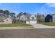 Beautiful two-story brick home featuring a three-car garage and a well-manicured lawn at 124 Felicity Pike, Locust Grove, GA 30248