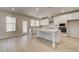 Eat-in kitchen with stainless steel appliances, modern white cabinets and white island countertop at 124 Felicity Pike, Locust Grove, GA 30248