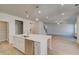 Modern eat-in kitchen with island, stainless steel dishwasher, and pendant lighting at 124 Felicity Pike, Locust Grove, GA 30248