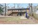 Spacious backyard with a deck, patio, and stairs leading to the upper level at 1343 Renee Dr, Decatur, GA 30035