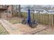 Backyard featuring a stone pathway leading to a cozy seating area with a blue umbrella at 1343 Renee Dr, Decatur, GA 30035