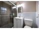 Bathroom showcasing a glass-enclosed shower, modern vanity, and toilet in a clean, well-lit space at 1343 Renee Dr, Decatur, GA 30035