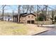 Brick home with two-car garage on a grassy lot with a fenced in backyard at 1343 Renee Dr, Decatur, GA 30035