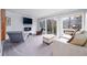 Bright living room with large windows, modern fireplace, and stylish furniture at 1343 Renee Dr, Decatur, GA 30035