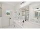 Elegant bathroom featuring a marble tiled shower, dual sinks, and recessed lighting at 1092 Glen Opal Dr, Decatur, GA 30032