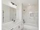 Bright bathroom showcasing dual vanity, modern faucet, and tiled shower at 1092 Glen Opal Dr, Decatur, GA 30032