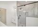 Modern bathroom with glass shower and white marble style walls at 1092 Glen Opal Dr, Decatur, GA 30032