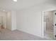 Spacious main bedroom with modern gray carpet and bright ensuite bathroom at 1092 Glen Opal Dr, Decatur, GA 30032