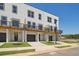 Townhouse exterior featuring garages, balconies, and modern design at 1092 Glen Opal Dr, Decatur, GA 30032