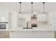 Modern kitchen with white cabinets, stainless steel appliances, and island at 1092 Glen Opal Dr, Decatur, GA 30032