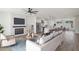 Open concept living area with fireplace, ceiling fan, and modern kitchen at 1092 Glen Opal Dr, Decatur, GA 30032