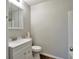 Bright bathroom featuring a modern vanity and mirror at 1098 Laurel Nw Ln, Conyers, GA 30012