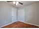 Inviting bedroom showcasing hardwood floors, ample closet space, a ceiling fan and natural light at 1098 Laurel Nw Ln, Conyers, GA 30012