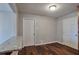 Open bonus room area featuring wood-look floors and a granite breakfast bar at 1098 Laurel Nw Ln, Conyers, GA 30012