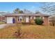 Charming brick ranch-style home with manicured front yard and inviting entrance at 1098 Laurel Nw Ln, Conyers, GA 30012