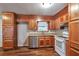 Spacious kitchen with wood cabinets, granite countertops, and stainless steel dishwasher at 1098 Laurel Nw Ln, Conyers, GA 30012