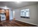 Bright and airy room with wood-look floors and a granite breakfast bar to the kitchen at 1098 Laurel Nw Ln, Conyers, GA 30012