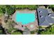 An aerial view of a community pool and bath house surrounded by lush greenery in a well maintained neighborhood at 253 Hailwood Ct, Suwanee, GA 30024