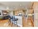 Gourmet kitchen with hardwood floors, granite countertops, an island, and an open flow layout at 253 Hailwood Ct, Suwanee, GA 30024