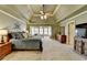 The main bedroom has a tray ceiling, sitting area, and an ensuite bathroom for a private retreat at 253 Hailwood Ct, Suwanee, GA 30024