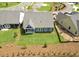 Aerial view of a well manicured backyard, covered patio, and blue single-Gathering home at 302 Bunker Hill Ct, Acworth, GA 30102