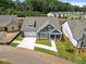 An aerial view of a single-Gathering home featuring blue siding and a manicured lawn at 302 Bunker Hill Ct, Acworth, GA 30102