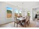 Well-lit dining area with a pendant light and a view of the backyard at 302 Bunker Hill Ct, Acworth, GA 30102